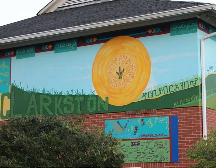 “Diversity Mural” 2014 - 36 x 8 foot mural on panels located on the Clarkston Community Center. Mural process created with community - Participation of 100 community members total, 43 languages total in the mural. Funded by The Community Foundation.
